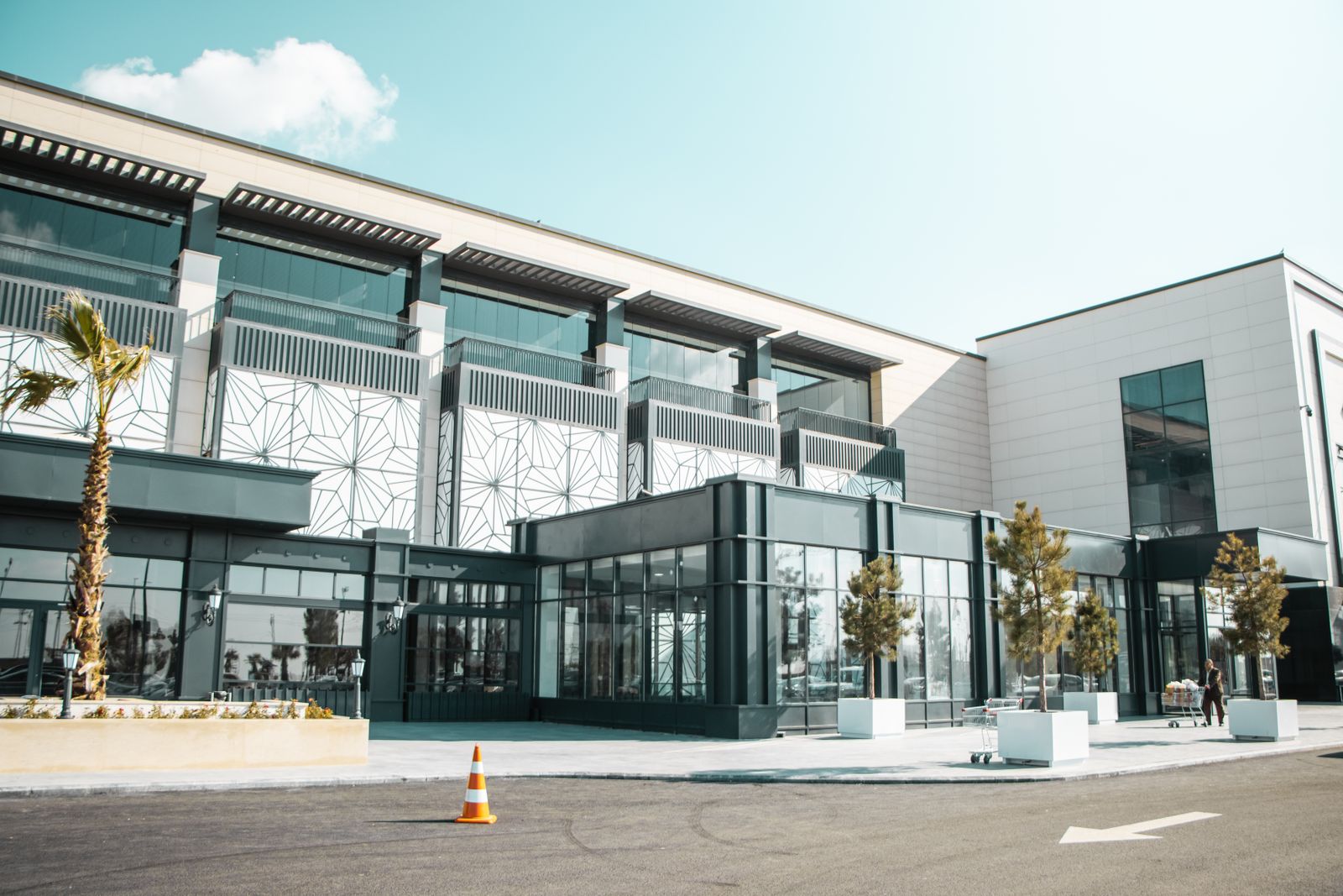 A modern single-storey clinic building with a glass entrance